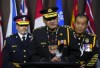 Chief Of Anishinabek Police Services Jeff Skye is joined by UCCM Anishnaabe Chief of Police James Killeen, left, and Treaty Three Police Chief Kai Liu as he speaks at a press conference on Parliament Hill in Ottawa, Monday, June 12, 2023. A lawyer with the Assembly of First Nations says including the recognition of their rights in legislation declaring First Nations policing an essential service is one of the 