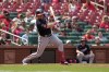 Washington Nationals' Lane Thomas follows through on an RBI single during the 10th inning in the first game of a baseball doubleheader against the St. Louis Cardinals Saturday, July 15, 2023, in St. Louis. The contest was the resumption of a game started on Friday, but was suspended due to rain. (AP Photo/Jeff Roberson)