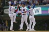 From left to right, Chicago Cubs' Christopher Morel, Seiya Suzuki and Nico Hoerner celebrate after their win over the Boston Red Sox in a baseball game Saturday, July 15, 2023, in Chicago. (AP Photo/Erin Hooley)