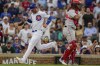 Chicago Cubs' Cody Bellinger, left, jogs past Boston Red Sox catcher Jorge Alfaro to score during the seventh inning of a baseball game Saturday, July 15, 2023, in Chicago. (AP Photo/Erin Hooley)