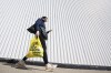 Canada’s inflation rate fell to 2.8 per cent in June, down from 3.4 per cent in May and putting it within the Bank of Canada’s target range for the first time since March 2021. While headline inflation continues to tick down, Canadians are still feeling the pinch on their grocery bills, as food inflation showed no improvement last month. A person leaves a Toronto supermarket with groceries on Wednesday, Oct. 5, 2022.THE CANADIAN PRESS/Alex Lupul