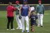 National League's Clayton Kershaw, of the Los Angeles Dodgers, walks with his son during bating practice before the MLB All-Star baseball Home Run Derby in Seattle, Monday, July 10, 2023. (AP Photo/Ted Warren)
