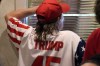 A supporter keeps watch for the arrival of former President Donald Trump at the Grimes Community Complex Park, Tuesday, July 18, 2023, in Des Moines, Iowa. (AP Photo/Charlie Neibergall)