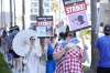 Picketers dressed as characters from 