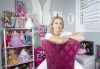 Barbie collector Natasha Philpott poses with her collection in Bradford, Ont., on Wednesday July 19, 2023. THE CANADIAN PRESS/Mark Blinch