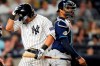 New York Yankees' Anthony Volpe, left, reacts after striking out during the fifth inning of a baseball game against the Tampa Bay Rays, Monday, July 31, 2023, in New York. (AP Photo/Frank Franklin II)