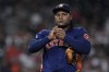 Houston Astros starting pitcher Framber Valdez rubs a baseball after walking Cleveland Guardians designated hitter Oscar Gonzalez during the fifth inning of a baseball game, Tuesday, Aug. 1, 2023, in Houston. (AP Photo/Kevin M. Cox)
