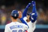 Toronto Blue Jays' George Springer (4) celebrates his RBI single against the Baltimore Orioles during fourth inning American League MLB baseball action in Toronto on Wednesday, August 2, 2023. THE CANADIAN PRESS/Nathan Denette