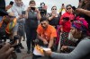 JESSICA LEE / WINNIPEG FREE PRESS

Devon Daniels from Long Plains First Nation (in orange) with Wahpikwanees Kappo (right) burn an injunction order from the city July 14, 2023 at Brady Landfill. The order is telling the protestors they must leave the main road.

Reporter: Chris Kitching