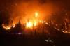 DARRYL DYCK / THE CANADIAN PRESS 
                                The McDougall Creek wildfire burns on the mountainside above a lakefront home, in West Kelowna, B.C., on Friday, August 18, 2023.
