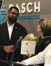 CAROL SANDERS / WINNIPEG FREE PRESS
                                Sport, Culture and Heritage Minister Obby Khan at the DASCH press conference is presented with a thank-you gift by DASCH Foundation chairperson Karen Menkis Thursday.