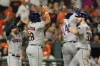 Houston Astros' Kyle Tucker, right, celebrates his ninth inning grand slam with Jose Altuve, left, Jon Singleton, second from left, and Yordan Alvarez (44) during a baseball game against the Baltimore Orioles, Tuesday, Aug. 8, 2023, in Baltimore. The Astros won 7-6. (AP Photo/Julio Cortez)
