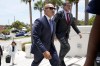 FILE - Walt Nauta, a valet to former President Donald Trump, left, arrives with defense attorney Stanley Woodward, right, at the Alto Lee Adams Sr. U.S. Courthouse for a pretrial conference to discuss procedures for handling classified information, July 18, 2023, in Fort Pierce, Fla. The property manager of Donald Trump's Mar-a-Lago estate and an aide to the former president are due back in federal court in Florida to face charges in the case accusing Trump of illegally hoarding classified documents at his club. (AP Photo/Lynne Sladky, File)
