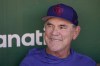 FILE - Texas Rangers manager Bruce Bochy speaks to reporters before a baseball game against the Oakland Athletics in Oakland, Calif., Aug. 7, 2023. Now guiding the Rangers, Bochy returns Friday to San Francisco where he remains beloved for helping bring the city its first World Series championship since moving West in 1958 with an improbable title won against Texas in 2010 — then two more in 2012 and '14 in a stretch that became the Giants' every-other-year magic. (AP Photo/Jeff Chiu)