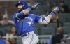 FILE - Toronto Blue Jays' Jose Bautista (19) follows through on a solo home run during the eighth inning against the Atlanta Braves in a baseball game Wednesday, May 17, 2017, in Atlanta. Former big league slugger José Bautista is signing a one-day contract so he can retire with the Toronto Blue Jays. The Blue Jays announced the deal on Friday, Aug. 11, 2023. (AP Photo/John Bazemore, File)