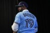 Jose Bautista is officially retiring as a member of the Toronto Blue Jays.&nbsp;Bautista attends a news conference in a team jersey bearing his name, in Toronto, Friday, Aug. 11, 2023, after signing a one day contract as the Jays prepare to honour Bautista's legacy. THE CANADIAN PRESS/Chris Young