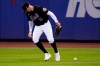 New York Mets right fielder Brandon Nimmo loses control of the ball hit by Atlanta Braves' Eddie Rosario for a three-run single during the fourth inning of a baseball game Friday, Aug. 11, 2023, in New York. Rosario advanced to second base on a fielding error by Nimmo. (AP Photo/Frank Franklin II)