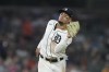 Detroit Tigers shortstop Javier Baez catches the popup hit by Tampa Bay Rays' Jose Siri during the ninth inning of a baseball game, Friday, Aug. 4, 2023, in Detroit. (AP Photo/Carlos Osorio)