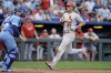 St. Louis Cardinals' Lars Nootbaar (21) runs home to score on a single by Willson Contreras during the fifth inning of a baseball game against the Kansas City Royals Saturday, Aug. 12, 2023, in Kansas City, Mo. (AP Photo/Charlie Riedel)
