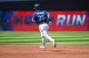 Daulton Varsho had a three-run homer and a two-run single to lead the Toronto Blue Jays past the Chicago Cubs 11-4 on Sunday to avoid a three-game sweep. Varsho (25) runs the bases after hitting a three run home run scoring teammates Cavan Biggio and Danny Jansen against the Chicago Cubs in second inning MLB interleague baseball action in Toronto, Sunday, Aug. 13, 2023. THE CANADIAN PRESS/Jon Blacker