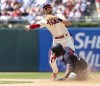 Philadelphia Phillies shortstop Trea Turner throws to first after tagging out Minnesota Twins' Michael A. Taylor (2) during the fifth inning of a baseball game, Sunday, Aug. 13, 2023, in Philadelphia. (AP Photo/Laurence Kesterson)