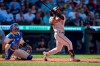 Baltimore Orioles' Cedric Mullins , right, watches the flight of his two-run home run against the Seattle Mariners during the 10th inning a baseball game, Sunday, Aug. 13, 2023, in Seattle. (AP Photo/John Froschauer)