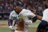 Tampa Bay Rays' Wander Franco reacts after being doused by teammates during a television interview after the Rays defeated the Cleveland Guardians in a baseball game Friday, Aug. 11, 2023, in St. Petersburg, Fla. (AP Photo/Scott Audette)