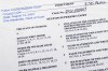 The indictment in Georgia against former President Donald Trump is photographed Monday, Aug. 14, 2023. Trump and several allies have been indicted in Georgia over efforts to overturn his 2020 election loss in the state. The criminal case announced Monday is the fourth brought against the ex-president in a matter of months. (AP Photo/Jon Elswick)