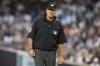 FILE - Umpire Ángel Hernández during the first inning of a baseball game between the New York Yankees and the Houston Astros, Friday, Aug. 4, 2023, in New York. Hernández lost again in his race discrimination lawsuit against Major League Baseball when a federal appeals court refused to reinstate his case on Tuesday, Aug. 15, 2023. (AP Photo/Frank Franklin II, File)