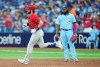 Philadelphia Phillies' Bryce Harper (left) rounds the bases after hitting a solo home run as Toronto Blue Jays first baseman Vladimir Guerrero Jr. looks on during third inning MLB interleague baseball action in Toronto on Wednesday, August 16, 2023. THE CANADIAN PRESS/Nathan Denette