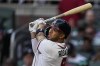 Atlanta Braves' Eddie Rosario watches his two-run home run against the New York Yankees during the second inning of a baseball game Wednesday, Aug. 16, 2023, in Atlanta. (AP Photo/John Bazemore)