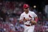 St. Louis Cardinals shortstop Masyn Winn jogs off the field after playing during the first inning of a baseball game against the New York Mets in his major league debut Friday, Aug. 18, 2023, in St. Louis. (AP Photo/Jeff Roberson)