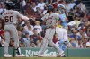 Detroit Tigers' Eric Haase (13) celebrates with teammate Akil Baddoo as Boston Red Sox catcher Reese McGuire looks on after hitting a home run during the fifth inning of a baseball game at Fenway Park, Saturday, Aug. 12, 2023, in Boston. (AP Photo/Mary Schwalm)