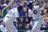 Chicago Cubs' Seiya Suzuki, right, of Japan, celebrates with third base coach Willie Harris after hitting a solo home run during the fifth inning of a baseball game against the Kansas City Royals in Chicago, Sunday, Aug. 20, 2023. (AP Photo/Nam Y. Huh)