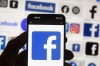 The Friends of Canadian Broadcasting group is asking people to stop posting content on Meta's platforms on Aug. 23 and 24. The Facebook logo is seen on a mobile phone, Oct. 14, 2022, in Boston. THE CANADIAN PRESS/AP-Michael Dwyer