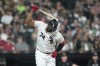 Chicago White Sox's Eloy Jimenez slams his bat down after flying out with two runners on base to end the fifth inning of the team's baseball game against the Seattle Mariners on Tuesday, Aug. 22, 2023, in Chicago. (AP Photo/Charles Rex Arbogast)