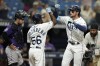 Tampa Bay Rays' Josh Lowe celebrates with Randy Arozarena (56) after Lowe hit a two-run home run off Colorado Rockies relief pitcher Matt Koch during the eighth inning of a baseball game Thursday, Aug. 24, 2023, in St. Petersburg, Fla. (AP Photo/Chris O'Meara)