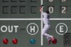 Boston Red Sox center fielder Adam Duvall (18) is unable to get his glove on a double hit by Los Angeles Dodgers' Max Muncy in the third inning of a baseball game, Sunday, Aug. 27, 2023, in Boston. (AP Photo/Steven Senne)