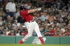 Boston Red Sox's Adam Duvall hits a two-run in the fifth inning of a baseball game against the Houston Astros, Monday, Aug. 28, 2023, in Boston. (AP Photo/Steven Senne)