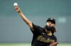 Pittsburgh Pirates starting pitcher Andre Jackson throws during the first inning of a baseball game against the Kansas City Royals Wednesday, Aug. 30, 2023, in Kansas City, Mo. (AP Photo/Charlie Riedel)