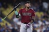 Arizona Diamondbacks' Ketel Marte reacts after popping out to Los Angeles Dodgers catcher Austin Barnes in foul territory to end the top of the third inning of a baseball game Wednesday, Aug. 30, 2023, in Los Angeles. (AP Photo/Ryan Sun)