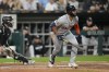 Detroit Tigers' Riley Greene, right, watches his single, which allowed Parker Meadows and Jake Rogers to score, during the fifth inning of a baseball game against the Chicago White Sox, Friday, Sept. 1, 2023, in Chicago. (AP Photo/Erin Hooley)