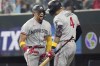 Minnesota Twins' Royce Lewis (23) celebrates his home run that scored three runs with teammate Carlos Correa (4) during the fifth inning of a baseball game against the Texas Rangers in Arlington, Texas, Sunday, Sept. 3, 2023. (AP Photo/LM Otero)