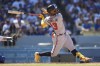 Atlanta Braves' Ronald Acuna Jr. (13) flies out during the eighth inning of a baseball game against the Los Angeles Dodgers in Los Angeles, Sunday, Sept. 3, 2023. (AP Photo/Ashley Landis)