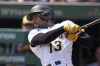 Pittsburgh Pirates' Ke'Bryan Hayes follows through on a solo home run off Milwaukee Brewers starting pitcher Freddy Peralta during the first inning of a baseball game in Pittsburgh, Wednesday, Sept. 6, 2023. (AP Photo/Gene J. Puskar)