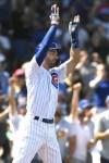 Chicago Cubs' Dansby Swanson (7) celebrates at home plate after scoring on a 3-RBI double hit by teammate Seika Suzuki during the first inning of a baseball game against the San Francisco Giants Wednesday, Sept. 6, 2023, in Chicago. (AP Photo/Paul Beaty)