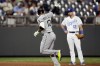 Chicago White Sox's Yoan Moncada celebrates as he runs home after hitting a solo home run during the sixth inning of a baseball game against the Kansas City Royals Wednesday, Sept. 6, 2023, in Kansas City, Mo. (AP Photo/Charlie Riedel)