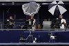 Pete Stendel, center, works a camera during the fifth inning of a baseball game between the Detroit Tigers and the New York Yankees on Thursday, Sept. 7, 2023, in New York. It was Stendel's first game back at Yankee Stadium since being hit by an errant throw. (AP Photo/Adam Hunger)