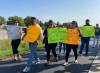 MALAK ABAS / WINNIPEG FREE PRESS
                                Driving instructors gather at the MPI centre on Bison Drive to protest and march with striking workers Friday morning.