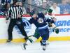 THE CANADIAN PRESS FILES/John Woods
                                Winnipeg Jets&rsquo; Neal Pionk and Minnesota Wild&rsquo;s Mason Shaw collide during NHL action in Winnipeg, March 8, 2023. Pionk says when it comes to judging the quality of his play in the NHL, he is his own worst critic, but he is making inroads at being more positive.